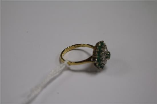 An 18ct gold, emerald and diamond cluster dress ring, size N.
